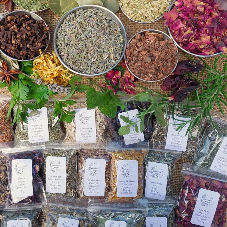 Assorted dried herbs and spices with labels on a woven mat